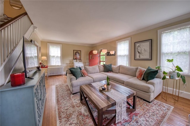 1010 Glenshaw Ave, Shaler, PA 15116 - living area with radiator, ornamental molding, stairway, light wood-style floors, and baseboards