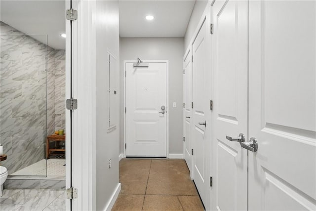 entryway with tile patterned flooring, recessed lighting, and baseboards
