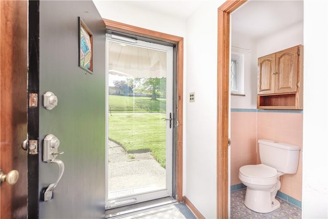 5251 Meadowgreen Dr, Whitehall, PA 15236 - entryway featuring tile walls and a wainscoted wall