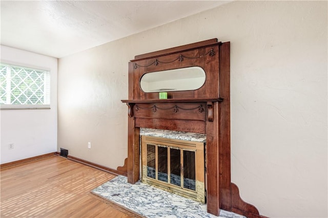 5251 Meadowgreen Dr, Whitehall, PA 15236 - unfurnished living room with wood finished floors, baseboards, and a glass covered fireplace