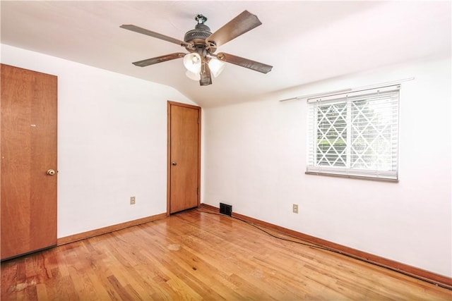 5251 Meadowgreen Dr, Whitehall, PA 15236 - spare room with baseboards, light wood-style floors, lofted ceiling, and ceiling fan