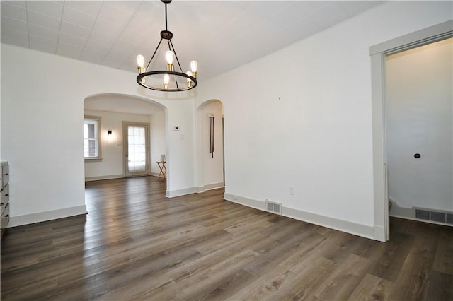 18 W Manilla Ave, Green Tree, PA 15220 - empty room with arched walkways, wood finished floors, a chandelier, and baseboards