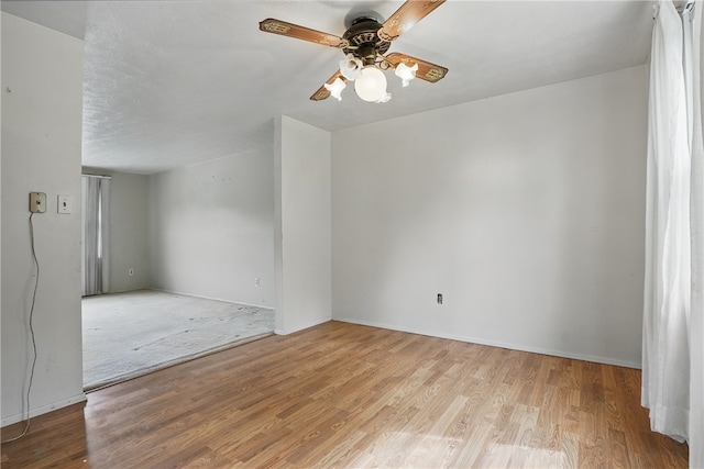 945 Key W Dr, Plum Boro, PA 15239 - empty room featuring ceiling fan, wood finished floors, and baseboards