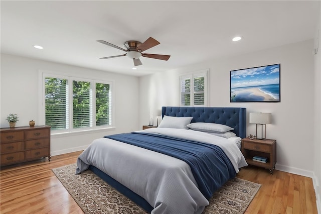 bedroom featuring baseboards, light wood-style flooring, ceiling fan, and recessed lighting