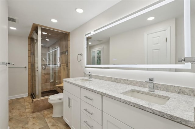 full bathroom with a stall shower, recessed lighting, toilet, and double vanity