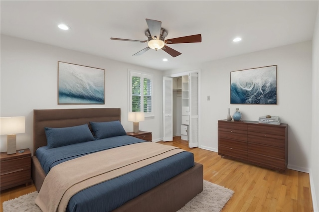 bedroom featuring light wood finished floors, recessed lighting, a closet, baseboards, and ceiling fan