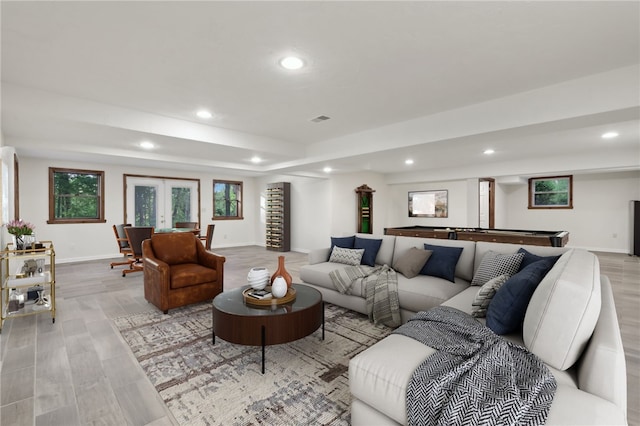 living room featuring recessed lighting, light wood finished floors, french doors, baseboards, and billiards table