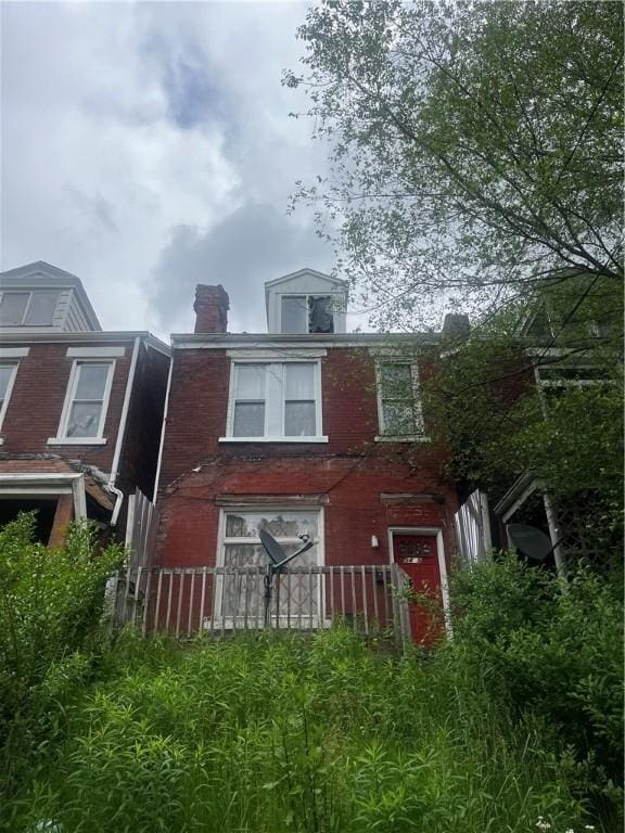 5415 2nd Ave, Hazelwood, PA 15207 - back of house with brick siding and a chimney