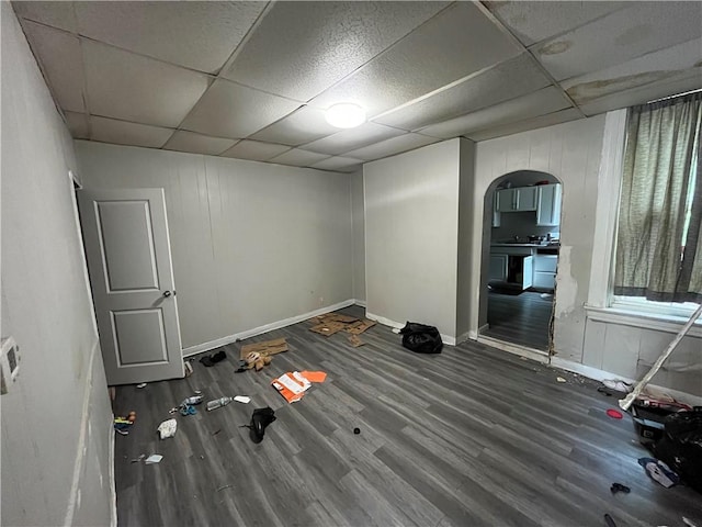 5415 2nd Ave, Hazelwood, PA 15207 - spare room featuring wood finished floors, arched walkways, a drop ceiling, and baseboards