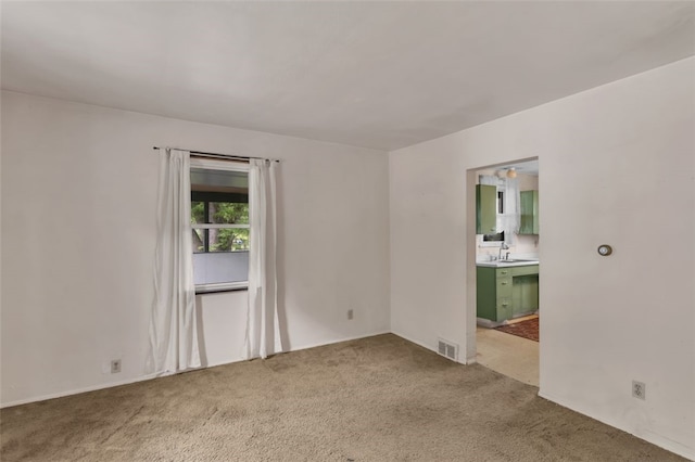 1108 Wills Ave, Lower Burrell, PA 15068 - spare room featuring carpet floors and a sink