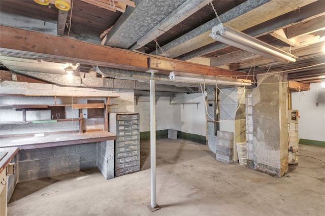 1108 Wills Ave, Lower Burrell, PA 15068 - unfinished below grade area featuring water heater and a workshop area