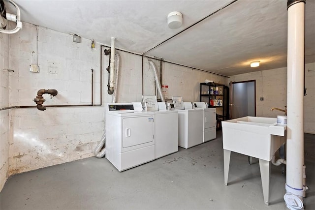 unfinished basement with washer and clothes dryer