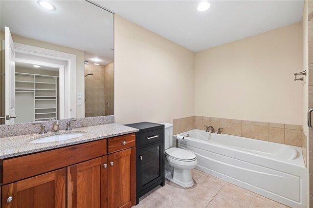 1219 Crescent Pl Unit 3C, Squirrel Hill, PA 15217 - bathroom with tile patterned flooring, a walk in closet, a garden tub, a shower stall, and vanity
