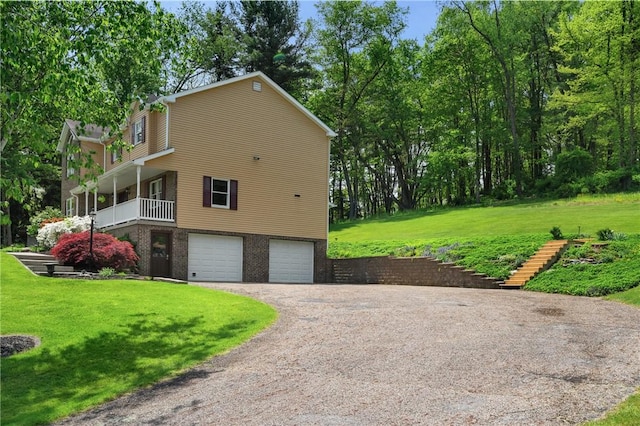 120 Rolling Mills Dr, Middlesex Twp, PA 16059 - view of side of property featuring driveway, a garage, a yard, and brick siding