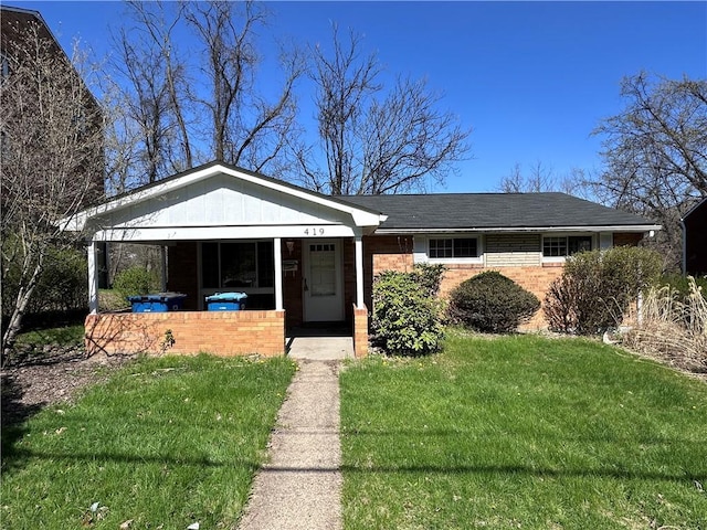 419 Elias Dr, Penn Hills, PA 15235 - view of front facade with a front lawn and brick siding