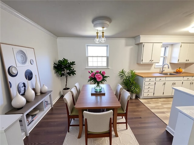 419 Elias Dr, Penn Hills, PA 15235 - dining space with light wood-style flooring, ornamental molding, and baseboards