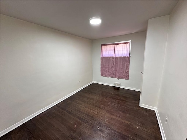 419 Elias Dr, Penn Hills, PA 15235 - spare room featuring baseboards and dark wood-type flooring