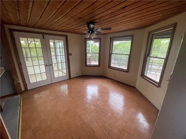 entryway featuring french doors, wood ceiling, and ceiling fan