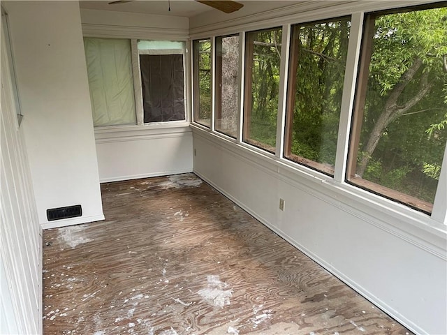 unfurnished sunroom with wood finished floors