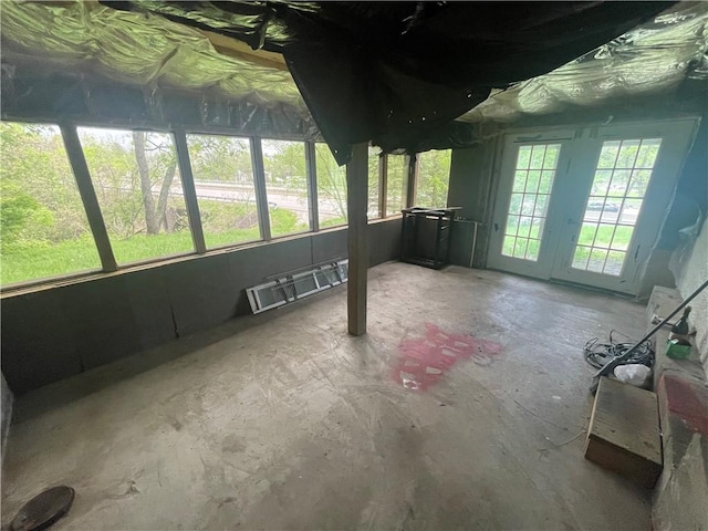 unfurnished sunroom featuring french doors