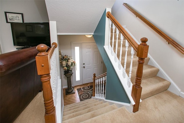 707 Cherry Blossom Ct, Murrysville, PA 15626 - stairs with a textured ceiling and baseboards