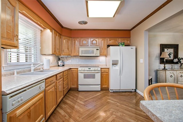 707 Cherry Blossom Ct, Murrysville, PA 15626 - kitchen with white appliances, a sink, light countertops, crown molding, and baseboards