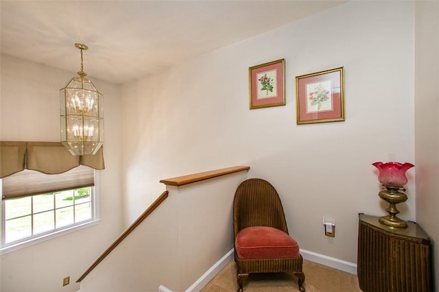 707 Cherry Blossom Ct, Murrysville, PA 15626 - living area with a chandelier, baseboards, an upstairs landing, and carpet floors