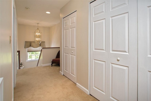 707 Cherry Blossom Ct, Murrysville, PA 15626 - hallway featuring light colored carpet, a chandelier, baseboards, an upstairs landing, and recessed lighting
