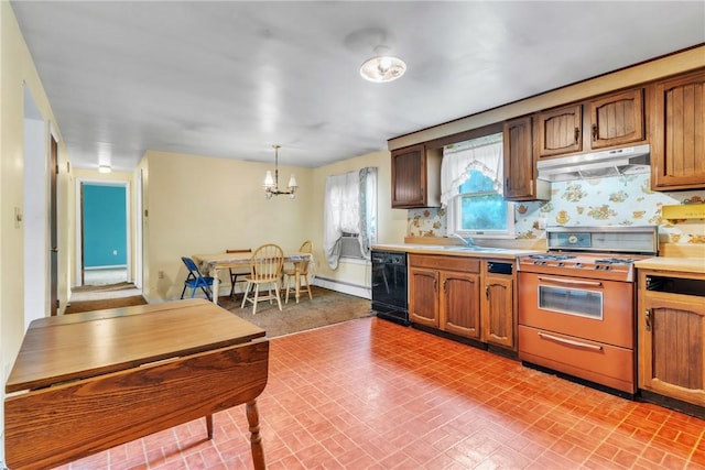 kitchen featuring white gas stove, under cabinet range hood, baseboard heating, light countertops, and a chandelier