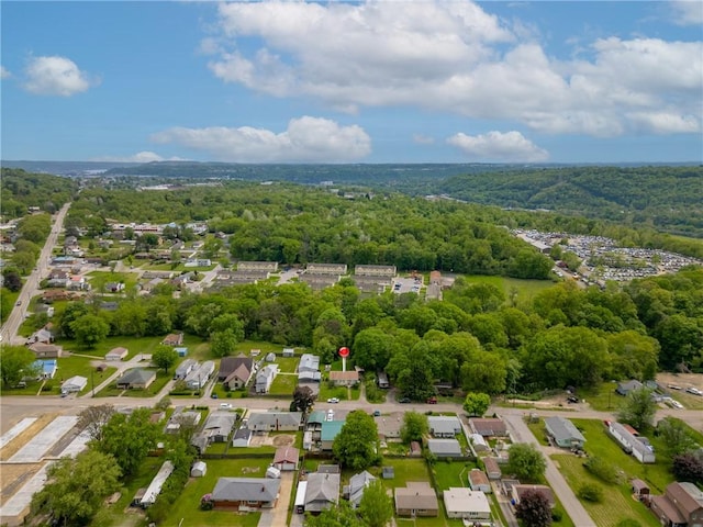 aerial perspective of suburban area featuring a forest