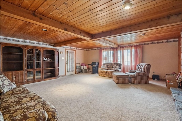 living area featuring carpet floors, wood ceiling, and beam ceiling