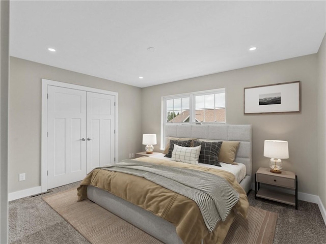 bedroom with carpet, baseboards, a closet, and recessed lighting