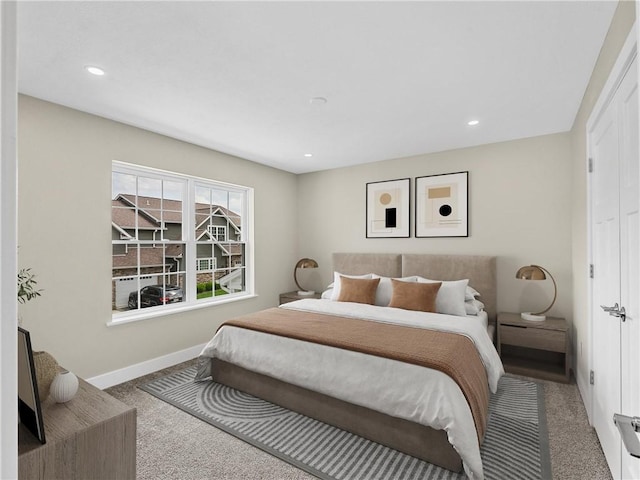 carpeted bedroom with baseboards and recessed lighting