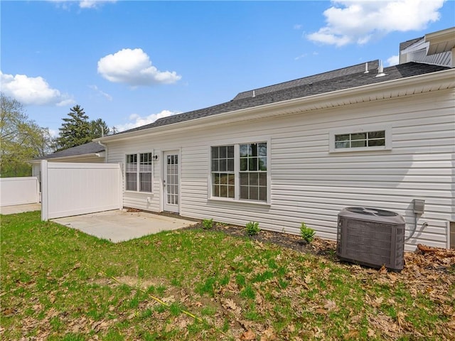 rear view of property featuring central AC and a patio area