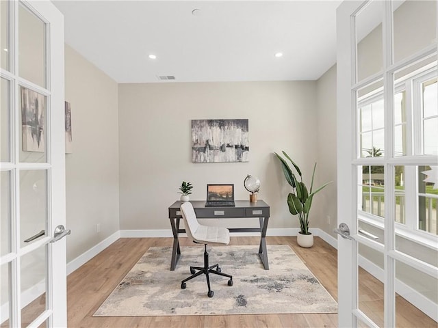 home office featuring french doors, baseboards, wood finished floors, and recessed lighting