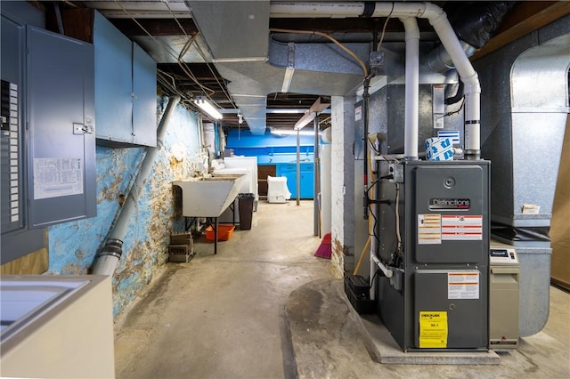 unfinished basement with a sink, heating unit, and electric panel