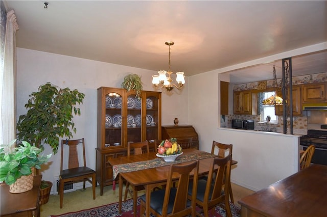 dining space featuring a chandelier