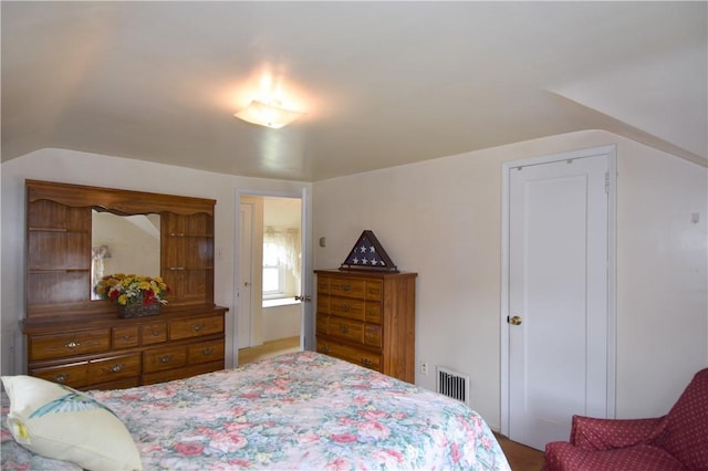 bedroom featuring vaulted ceiling