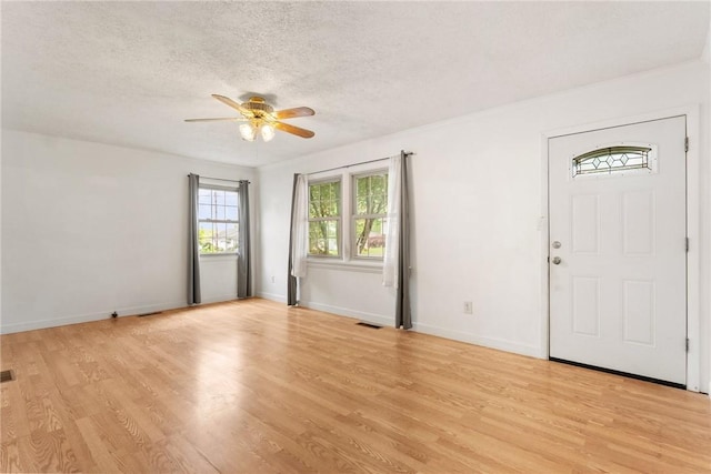 1024 Maine Ave, Hopewell Twp Bea, PA 15001 - foyer featuring a textured ceiling, a ceiling fan, light wood finished floors, and baseboards