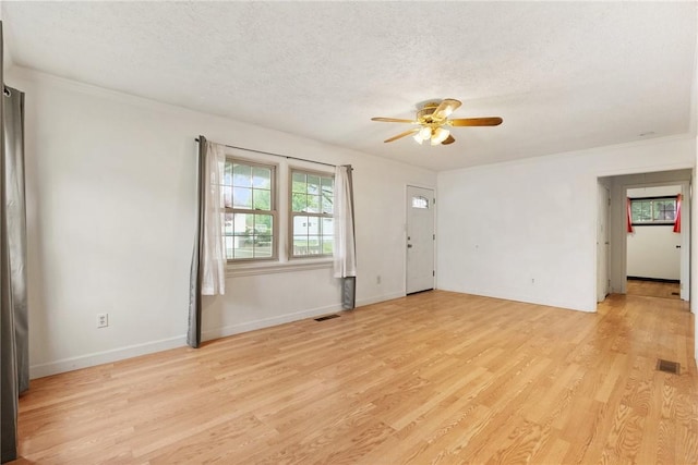 1024 Maine Ave, Hopewell Twp Bea, PA 15001 - unfurnished room featuring a ceiling fan, light wood-style flooring, a textured ceiling, crown molding, and baseboards