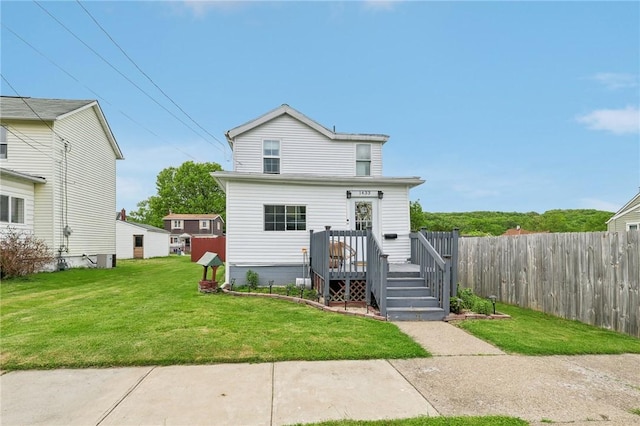 back of property featuring a wooden deck