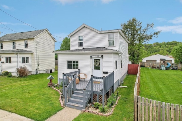 back of property featuring a wooden deck