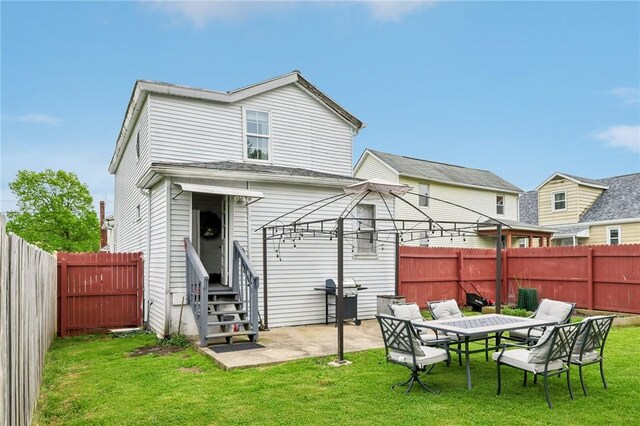 rear view of house featuring entry steps and a patio area
