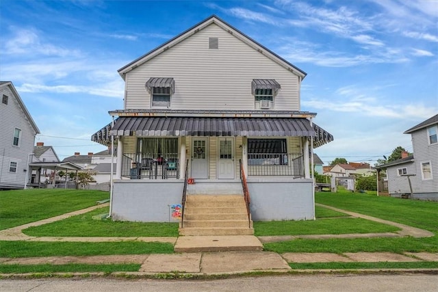 view of front of home featuring covered porch and a front lawn