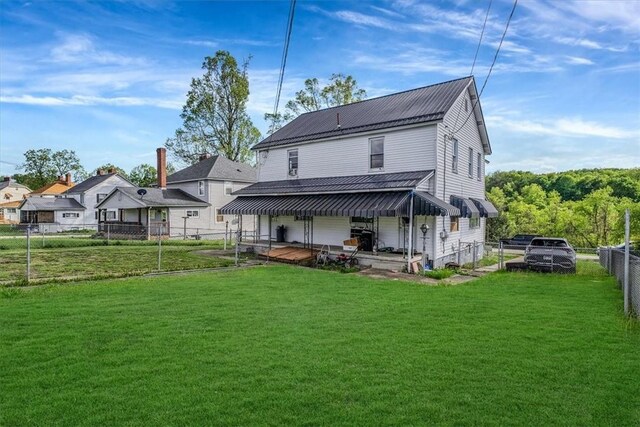 rear view of house with metal roof
