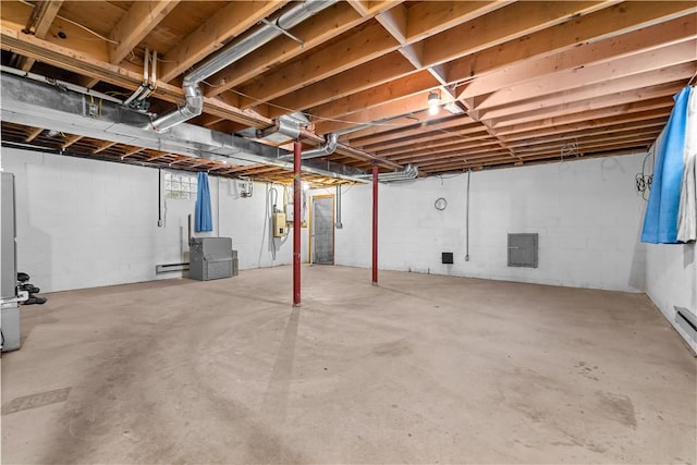 unfinished basement featuring electric panel and baseboard heating