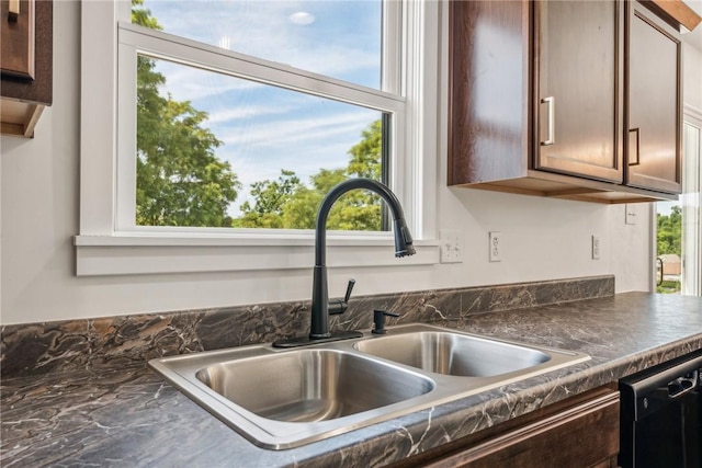 1621 Windsor Rd, North Huntingdon, PA 15642 - kitchen view of a sink, dark countertops, and dishwasher