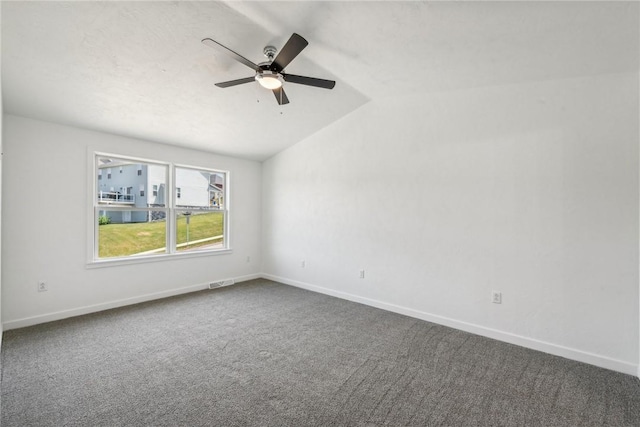 1621 Windsor Rd, North Huntingdon, PA 15642 - unfurnished room featuring baseboards, dark carpet, vaulted ceiling, and a ceiling fan