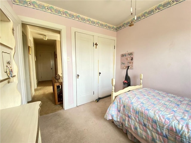 carpeted bedroom featuring a closet