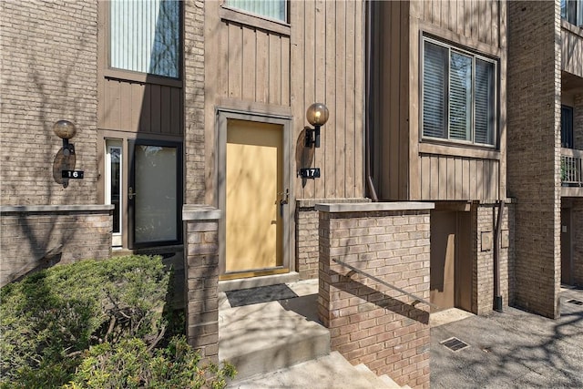 17 Maple Ct, Ross Twp, PA 15237 - doorway to property with board and batten siding and brick siding
